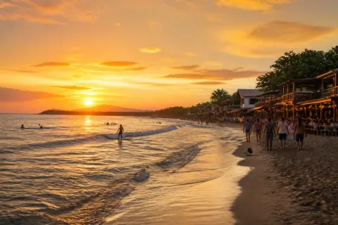 Sunset surfers and beachfront cafés at Urbiztondo Beach, San Juan, La Union