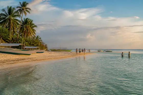 Kota Beach sandbar, small boats and palm trees near Santa Fe on Bantayan Island