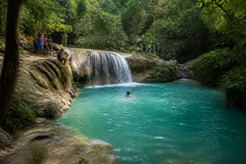 Turquoise lower pool and limestone ledges at Cambais Falls, Alegria, Cebu