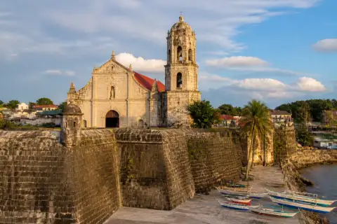 Capul Church fortress walls and bell tower with town plaza