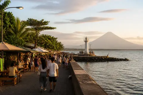 Embarcadero de Legazpi waterfront with lighthouse and distant Mt. Mayon