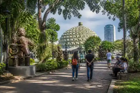 People’s Park durian-inspired dome and public sculptures with visitors in Davao City