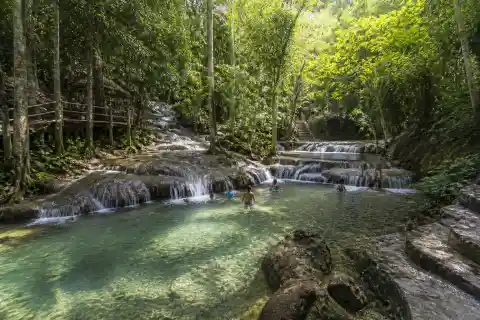Shaded natural pools and low cascades at Hagimit Falls, Samal Island