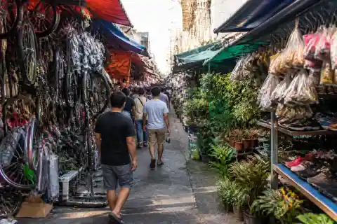 Cartimar market lane with stalls selling plants, bicycle parts and shoes