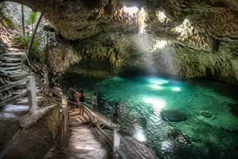 Hinagdanan Cave interior with stairs and sunlit lagoon