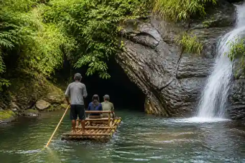 Bamboo raft approaching cave mouth on Jovellar (Quitinday) Underground River, Albay