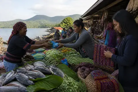 Morning market stalls in Lake Sebu with tilapia, vegetables and T'boli woven cloth