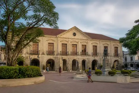 Restored coral-stone façade of the Old Provincial Capitol (National Museum Bohol) with Plaza Rizal