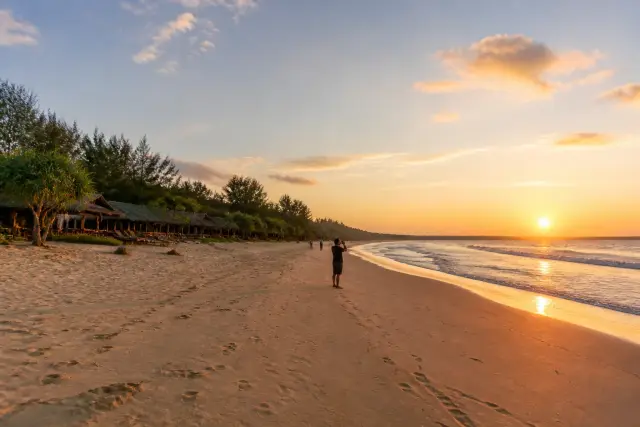 Wide west-facing view of New Agutaya long sandy beach at sunset, San Vicente, Palawan