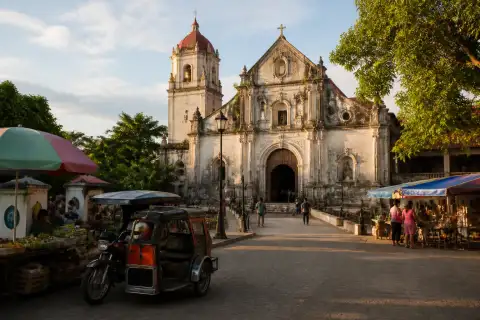 Provincial parish church and busy town plaza with market stalls in Pangasinan