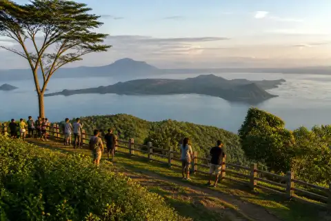 Visitors at the ridge lookout of People's Park in the Sky with Taal Lake visible