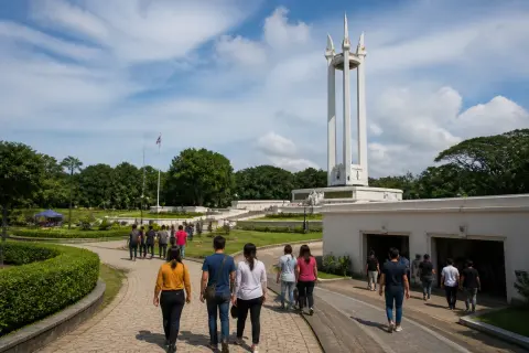 Quezon Memorial Shrine with visitors walking in Quezon Memorial Circle park