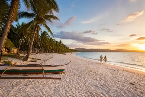 Long Beach shoreline in San Vicente at sunset with a small wooden banca