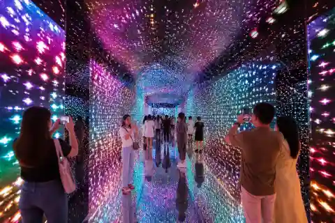Visitors in an LED tunnel at Space & Time Cube+ S Maison, Mall of Asia