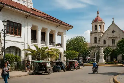 National Museum Bohol (Old Provincial Capitol) and Plaza Rizal with tricycles in Tagbilaran