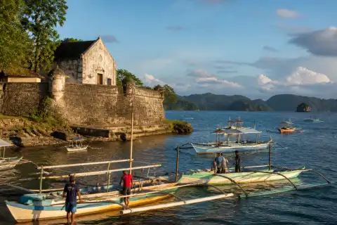 Coral-limestone Fort Santa Isabel overlooking Taytay Bay with small boats