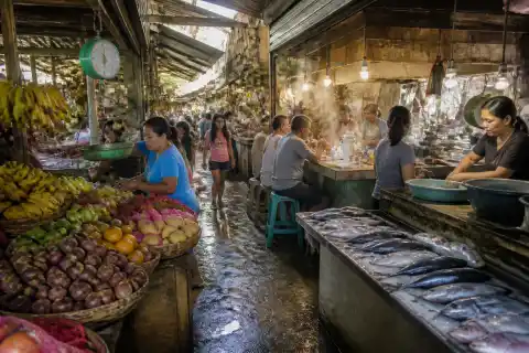 Early-morning Visayas public market stalls with fresh seafood and produce