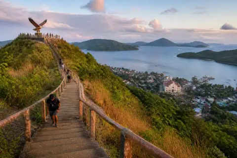 Staircase and hilltop viewpoint above Culion town with church, harbor and nearby islands