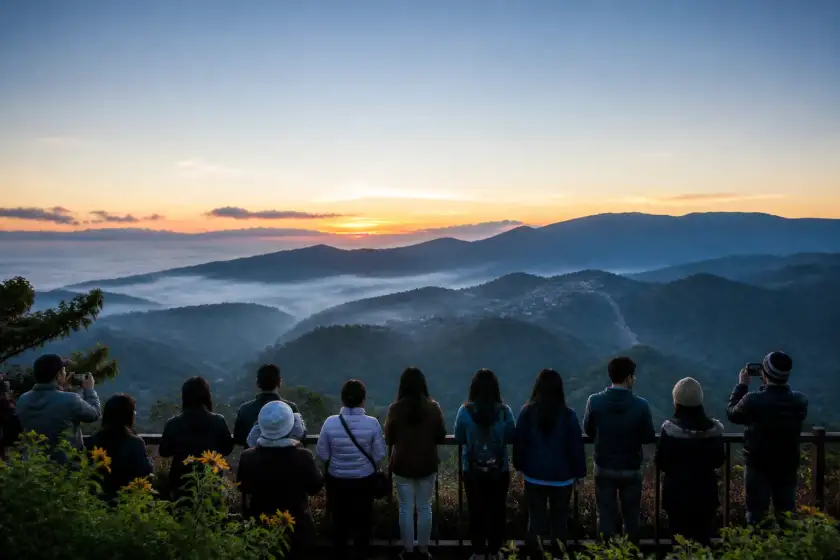 Visitors watching sunrise over Cordillera ridges from Mines View Park in Baguio
