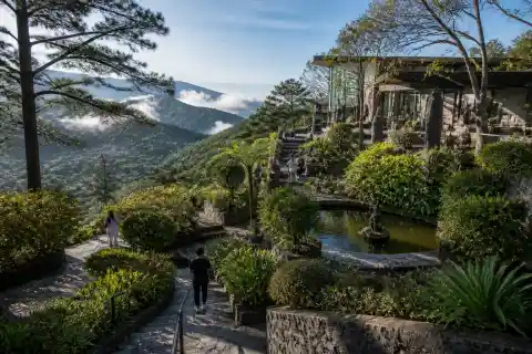Terraced garden, stone steps and sculptures at BenCab Museum with mountain views