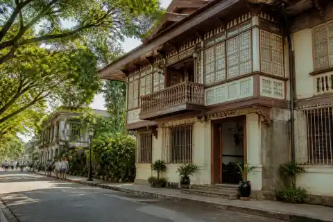 Facade of an ancestral house on a tree-lined Rizal Street in Silay