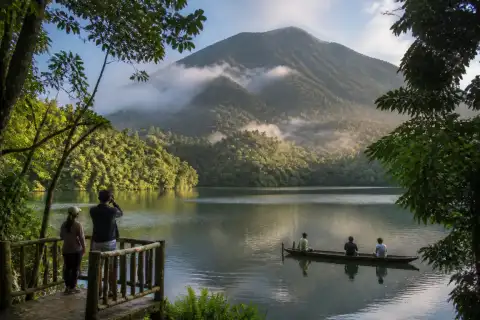 Bulusan Lake with rainforest and misty volcanic slopes