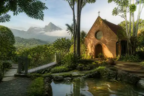 Transfiguration Chapel at Caleruega with gardens and Mount Batulao in the background
