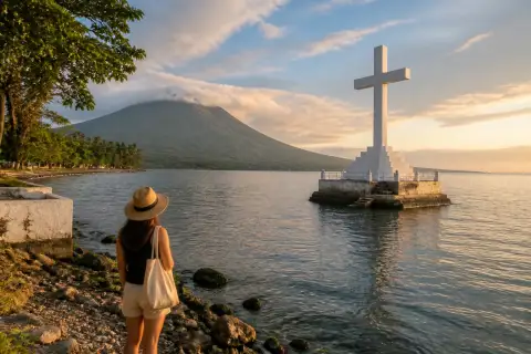 Sunken Cemetery cross offshore with Mount Vulcan beyond, Camiguin coast