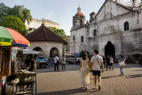 Pedestrians near the Basilica Minore del Santo Niño and Magellan’s Cross in downtown Cebu