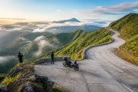 Winding Daang Kalikasan mountain road with sweeping curves and highland views
