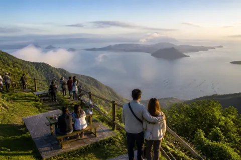 Morning Taal Lake view from a Tagaytay ridge viewpoint with picnic area