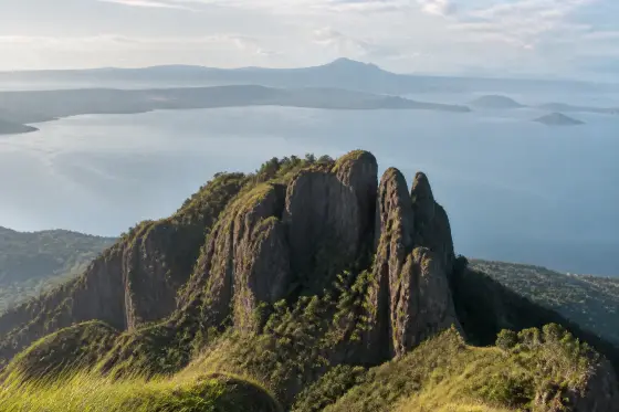 Mount Maculot's rocky viewpoint with Taal Lake in the background