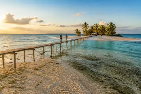 Stilt walkway and shallow turquoise sandbar at Onok Island, Balabac