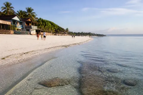 Long white-sand shoreline of Quinale Beach in Anda, Bohol