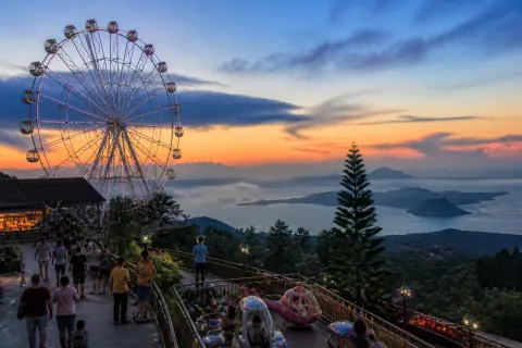Sky Eye ferris wheel at Sky Ranch Tagaytay with Taal Volcano in the background