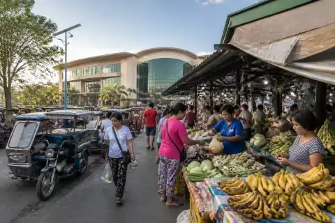 Shoppers browsing produce stalls at Tagbilaran’s Dao public market