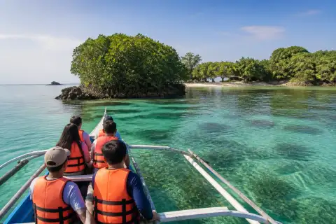 Local banca near mangroves and low islets in Taklong, Guimaras