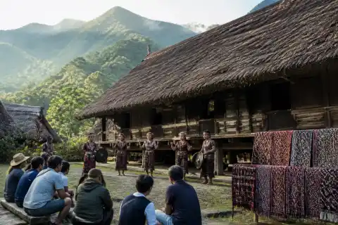 T'boli longhouse with performers and displayed t'nalak textiles in the Lake Sebu highlands