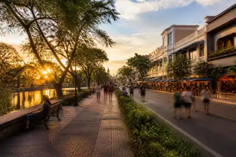Capitol Park and Lagoon at sunset with Lacson Street cafés in the background