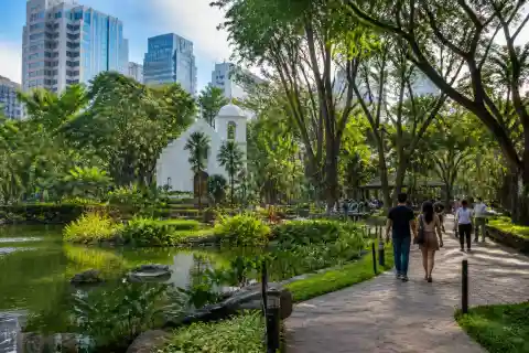 Greenbelt Park gardens and Makati skyline
