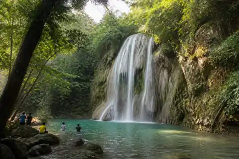 Daranak Falls cascade and pool with visitors