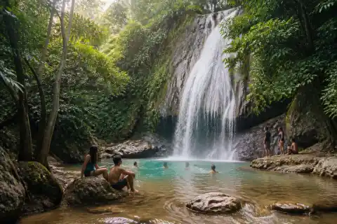 Visitors swimming at Daranak Falls in Tanay, Rizal, surrounded by tropical forest