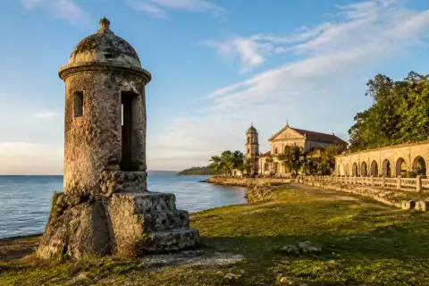 Poblacion Baluarte coral-stone watchtower ruin with Oslob waterfront