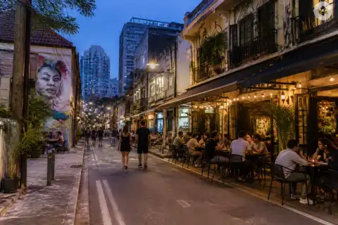 Poblacion street in Makati at early evening with restaurants and people dining