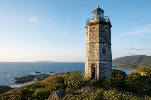 Spanish-era octagonal stone lighthouse on a remote Balabac Island coastline