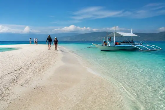 Sumilon Island sandbar with banca boat and clear water