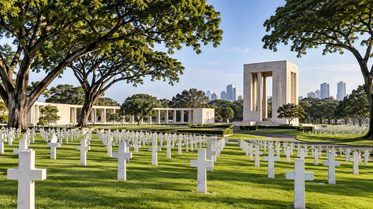 Respectful representative view of a military memorial cemetery with white headstones and a formal memorial in Taguig